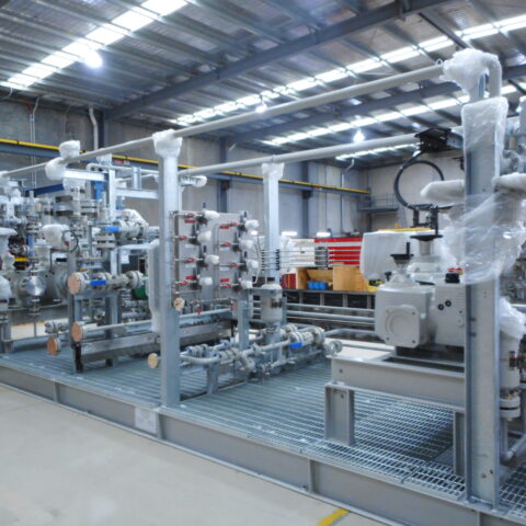 Custom pump skid system in fabrication workshop